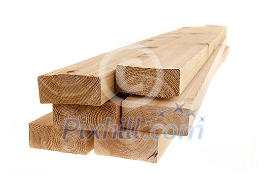 Edge of six cedar two by four wood boards on white background Edge of six cedar two by four wood boards on white background
