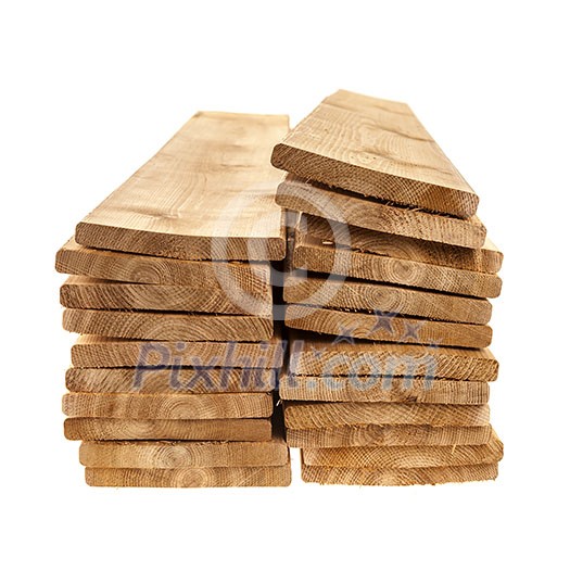 Stacks of one by six inch cedar boards on white background Stacks of one by six inch cedar boards on white background