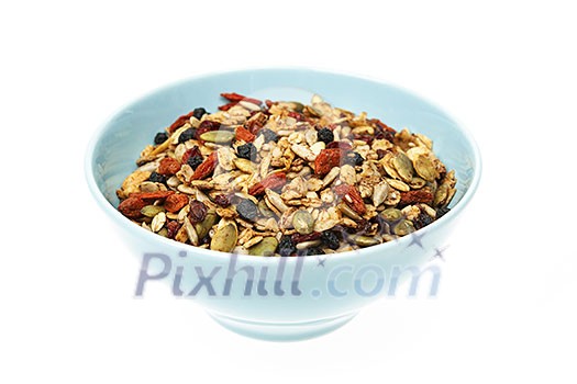 Bowl of homemade granola with various seeds and berries isolated on white background Bowl of homemade granola with various seeds and berries isolated on white background
