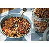 Serving of homemade granola on table with linens in morning sunlight