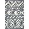 Closeup of knit fabric background with knitted grey and white geometric pattern