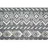 Closeup of knit fabric background with knitted grey and white geometric pattern