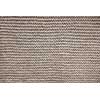 Knit texture of undyed natural brown wool knitted fabric with garter stitch pattern as background