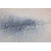 Grey and beige abstract background of wet sand texture formed by waves on beach