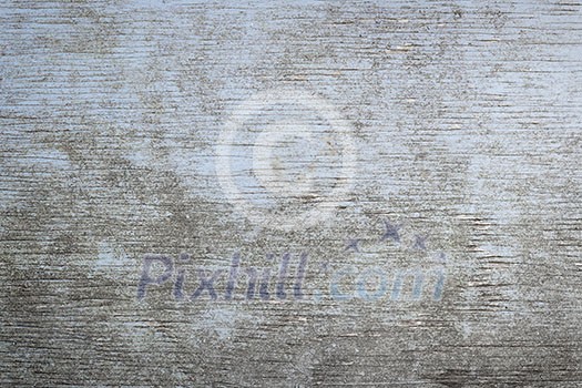 Old wooden background of weathered distressed rustic wood with faded light blue paint showing woodgrain texture Old wooden background of weathered distressed rustic wood with faded light blue paint showing woodgrain texture