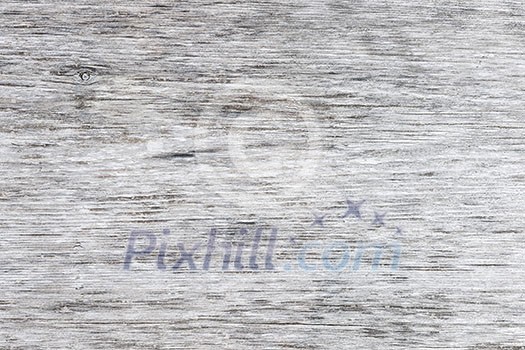 Gray wooden background of weathered distressed unpainted rustic wood showing woodgrain texture Gray wooden background of weathered distressed unpainted rustic wood showing woodgrain texture