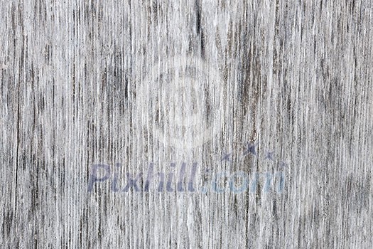 Gray wooden background of weathered distressed unpainted rustic wood showing woodgrain texture Gray wooden background of weathered distressed unpainted rustic wood showing woodgrain texture