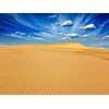 White sand dunes in desert on sunrise, Mui Ne, Vietnam.