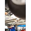 Inside a garage - changing wheels/tires (shallow DOF; color toned image)
