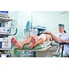 Feet of a patient ready for a surgery in a surgery room (color toned image; shallow DOF)