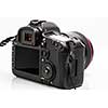 Professional modern DSLR camera - detail of the top LCD with settings - shutter speer, aperture, ISO, AF mode, battery info, RAW format indication,...