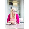 Pretty young college student in a library (shallow DOF; color toned image)