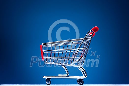 shopping cart on blue background