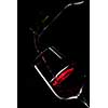 red wine pouring into wine glass isolated on black