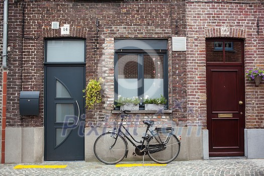 Bicycle on the street in Bruges, Belgium Bicycle on the street in Bruges, Belgium