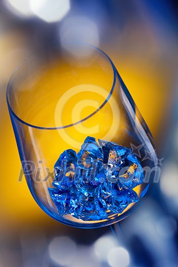 ice in wineglass on color background ice in wineglass on color background