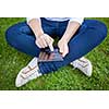 Woman using digital tablet PC in the park