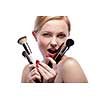 Young smiling woman with make up brushes isolated on white