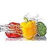 red, yellow and green pepper with water splash isolated on white