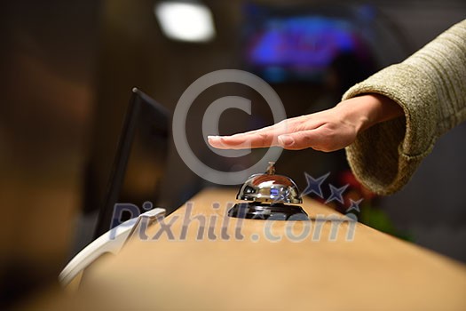 business woman at the reception of a hotel checking in business woman at the reception of a hotel checking in