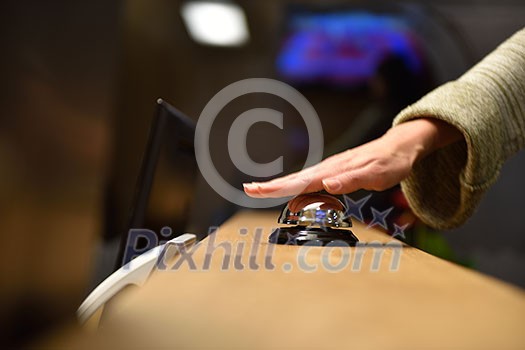 business woman at the reception of a hotel checking in business woman at the reception of a hotel checking in