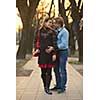 Happy and young pregnant couple have fun and relax outdoor