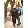 Happy and young pregnant couple have fun and relax outdoor
