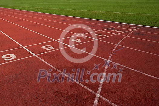 Red athletic track treadmill at the stadium with the numbering. Red athletic track treadmill at the stadium with the numbering.