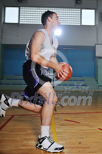 one healthy young man play basketball game in school gym indoor one healthy young man play basketball game in school gym indoor