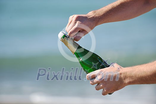 man hands open bottle of champagne alcohol and wine drink outdoor on party celebration event 