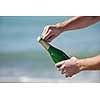 man hands open bottle of champagne alcohol and wine drink outdoor on party celebration event 