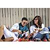happy young couple enjoying  picnic on the beach and have good time on summer vacations