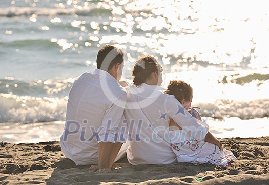 happy young family in white clothing have fun at vacations on beautiful beach happy young family in white clothing have fun at vacations on beautiful beach