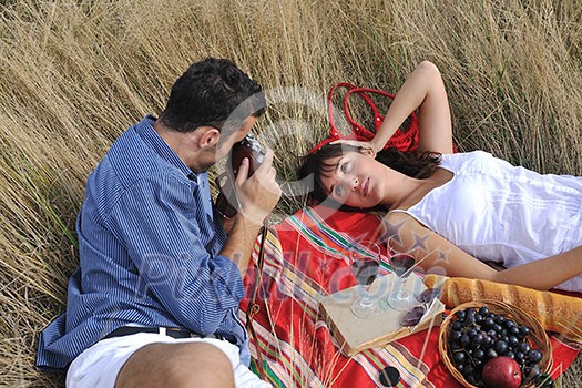 happy young couple relaxing in nature white making photos and taking images and posing for camera happy young couple relaxing in nature white making photos and taking images and posing for camera