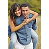 happy young couple have romantic time outdoor while smiling and hug