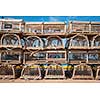 Stacks of wooden lobster traps on pier in North Rustico, Prince Edward Island, Canada.