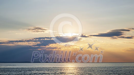 Sunset and sunbeams with dramatic sky over Atlantic Ocean in Prince Edward Island, Canada Sunset and sunbeams with dramatic sky over Atlantic Ocean in Prince Edward Island, Canada