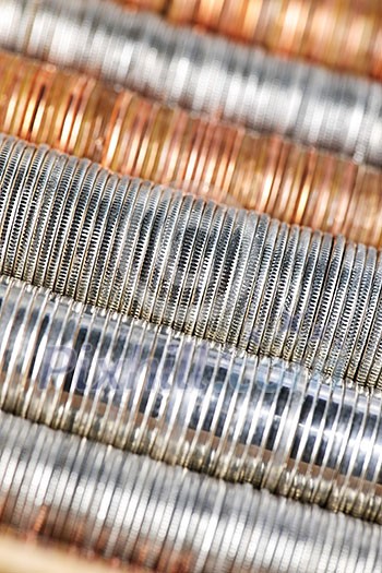 Background of penny nickel dime and quarter stacked coins Background of penny nickel dime and quarter stacked coins