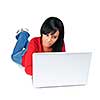 Black young woman typing on computer laying on floor
