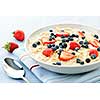 Bowl of hot oatmeal breakfast cereal with fresh berries