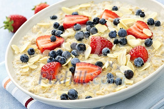 Bowl of hot oatmeal breakfast cereal with fresh berries Bowl of hot oatmeal breakfast cereal with fresh berries