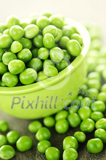 Closeup on bowl of fresh green organic green peas