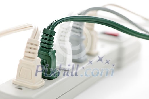 Many plugs plugged into electric power bar Many plugs plugged into electric power bar