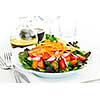 Plate of healthy green garden salad with fresh vegetables