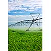 Industrial irrigation equipment on farm field in Saskatchewan, Canada