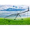 Industrial irrigation equipment on farm field in Saskatchewan, Canada