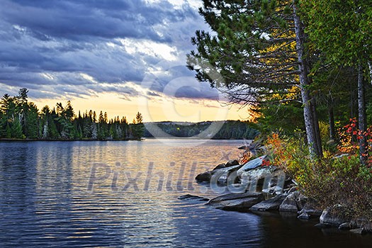 Dramatic sunset and pines at Lake of Two Rivers in Algonquin Park, Ontario, Canada Dramatic sunset and pines at Lake of Two Rivers in Algonquin Park, Ontario, Canada
