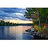 Dramatic sunset and pines at Lake of Two Rivers in Algonquin Park, Ontario, Canada