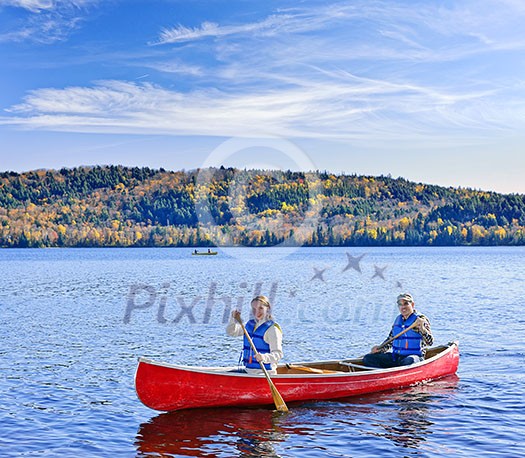 Father and daughter canoeing on Lake of Two Rivers, Ontario, Canada Father and daughter canoeing on Lake of Two Rivers, Ontario, Canada