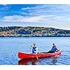 Father and daughter canoeing on Lake of Two Rivers, Ontario, Canada